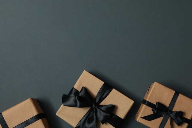 Craft gift boxes with bow on gray 