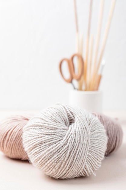 Photo craft knitting hobby background with yarn in natural colors