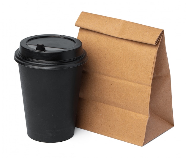 Craft paper bag with coffee cup on white background