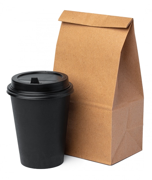 Craft paper bag with coffee cup on white background