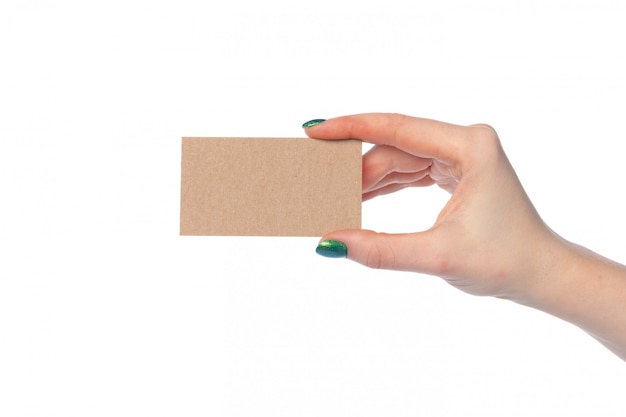 Craft paper card in female hand isolated on white