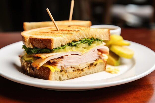 Crafted sandwich with turkey cheese lettuce and mustard on white plate