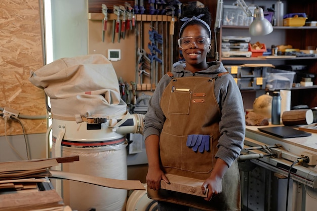 Crafting wooden pieces in workshop setting
