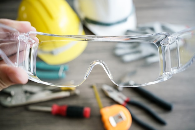 Craftsman tool, for man worker. Glasses safety in hand