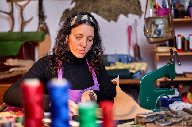 Craftswoman working leather