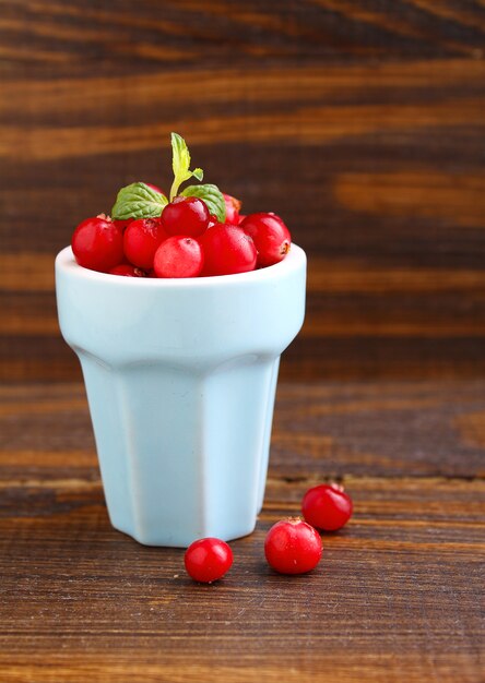 Cranberries in a blue cup