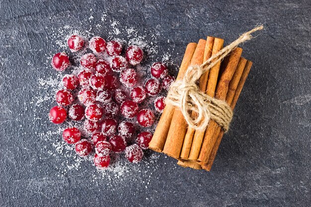 Cranberries in sugar and cinnamon sticks