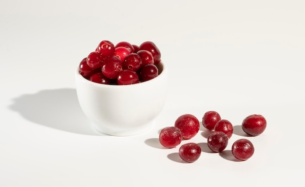 Cranberries vitamins on white background