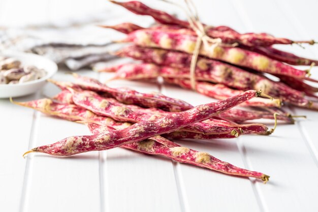 Cranberry beans Beans pods on a white table