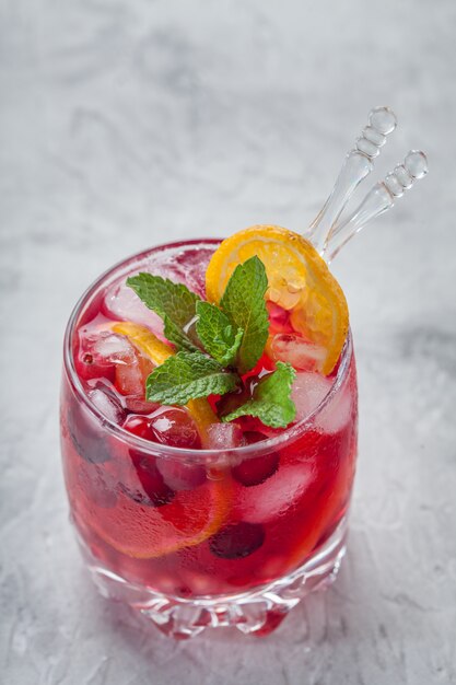 Cranberry cocktail with ice and mint