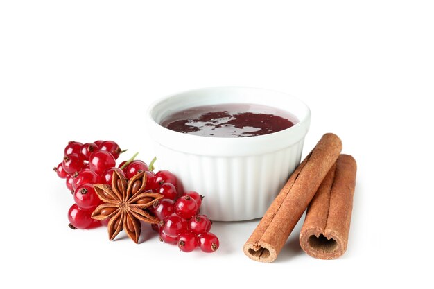 Cranberry sauce and ingredients isolated on white background