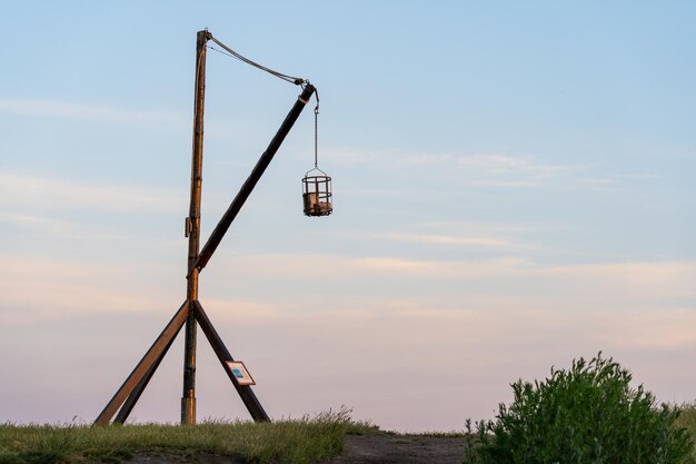 Crane against sky during sunset