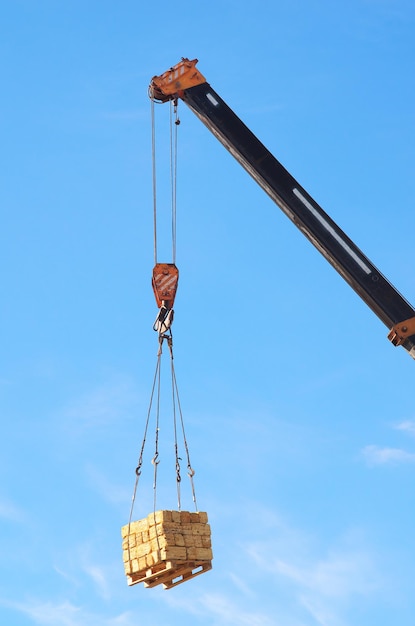 Crane and cargo. Element of building design.