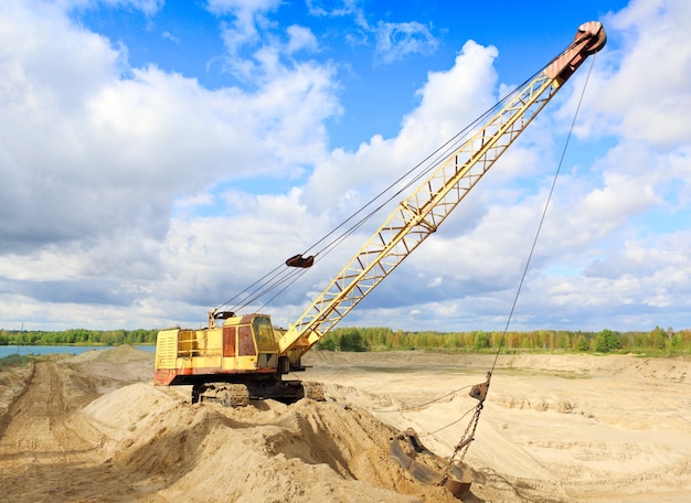 Crane in the earth career against the sky