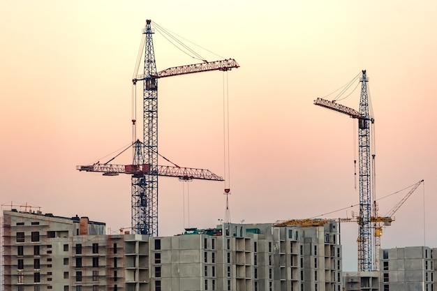 Cranes over the construction of urban housing.