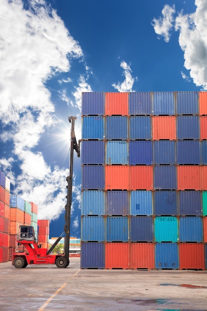 Photo cranes to loading the containers up truck in the harbor.