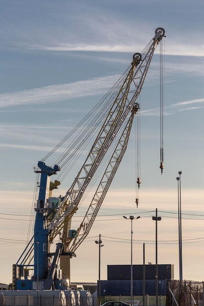 Cranes in the port of Sagunto network of cables lights and containers industrial infrastructure Sagunto Valencia Spain