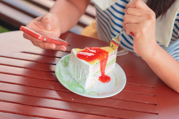 Crape cake dessert topped with sauce strawberry