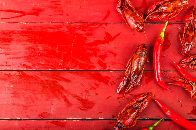 Photo crayfish. red boiled crawfishes on table in rustic style,  lobster closeup.