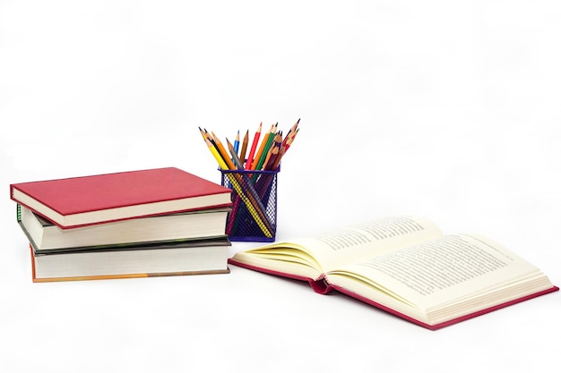crayon or colored pencils in box and the book placed knowledge and education concept