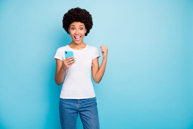 crazy beautiful lady holding telephone hands astonished