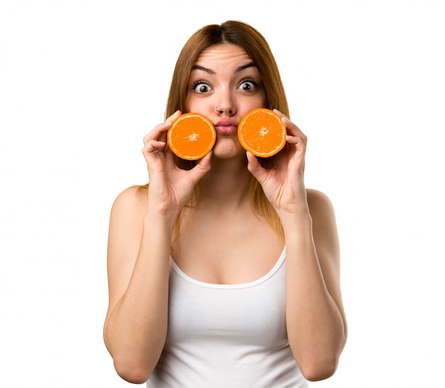 Crazy Beautiful young girl holding an orange juice