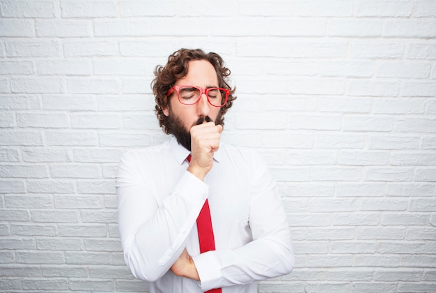 Crazy businessman expressing a concept. brick wall background