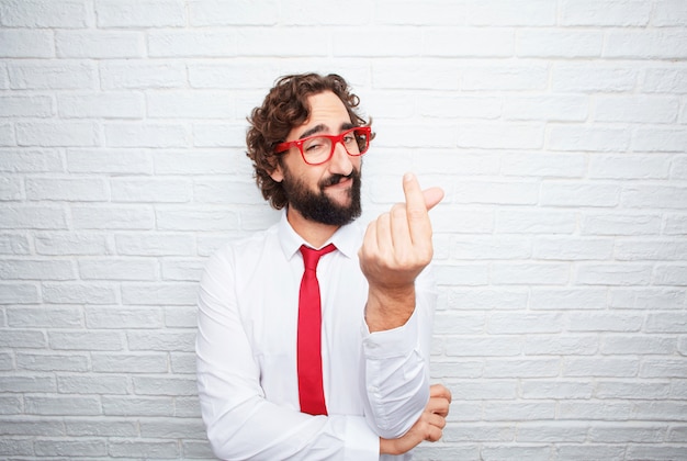 Crazy businessman expressing a concept. brick wall background