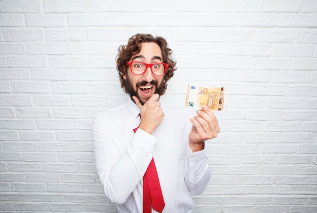 Crazy businessman expressing a concept. brick wall background