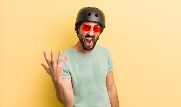 Photo crazy man with sunglasses skate concept