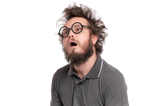 Photo crazy scared or shocked bearded man with funny haircut in eyeglasses looks worried silly