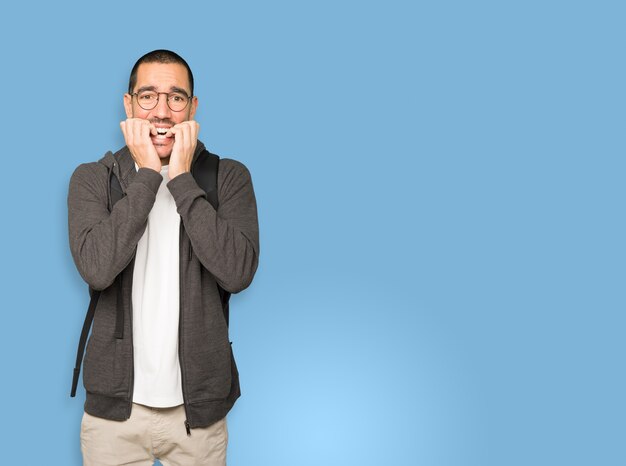 Crazy student making a nervous gesture