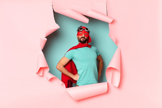 crazy  super hero man happily and proud in paper hole