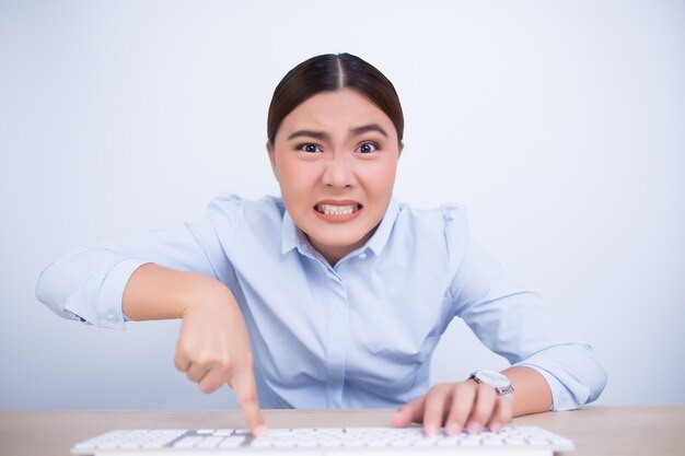 Crazy woman with hands on keyboard