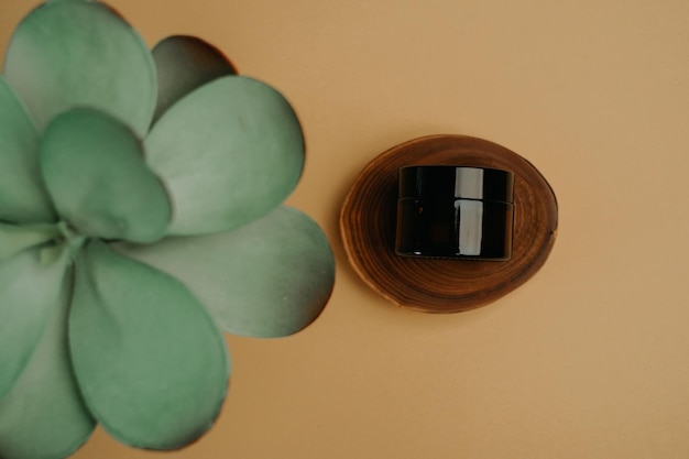 Cream container on a wooden slice