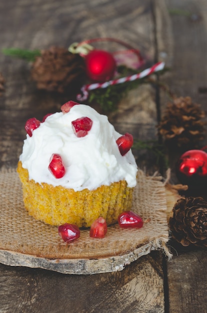 Cream cupcake with christmas decoration