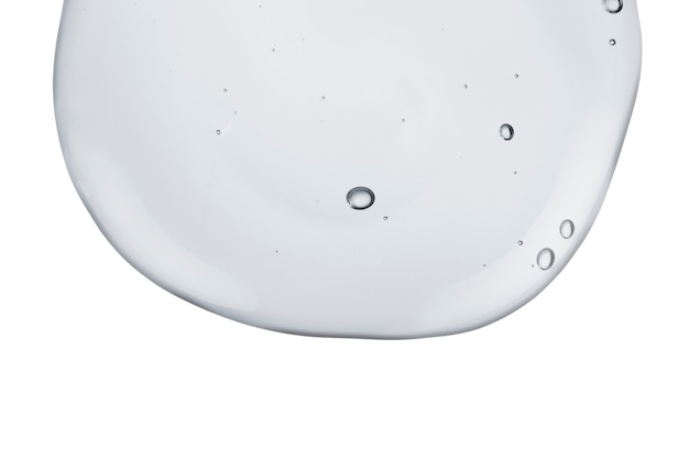 Cream gel roze doorzichtige cosmetische monstertextuur met geïsoleerde bubbels op witte achtergrond