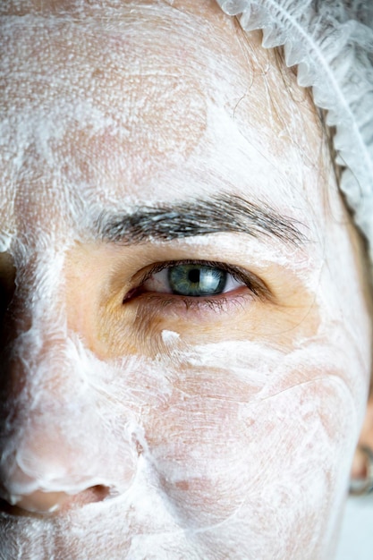 Cream mask on the face of the girl rejuvenating face mask