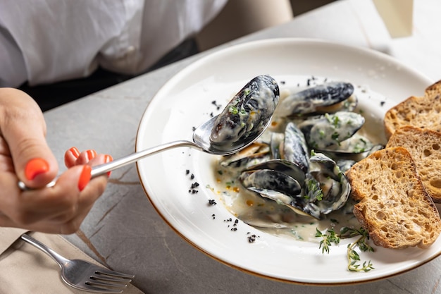 Cream of Mussel Soup on the table in the restaurant