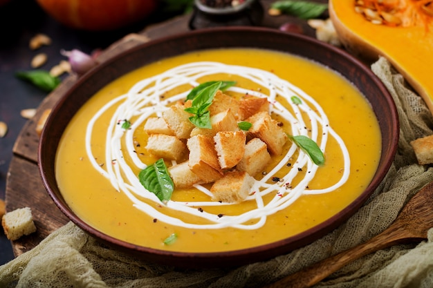 Cream of pumpkin soup with sour cream sauce. 