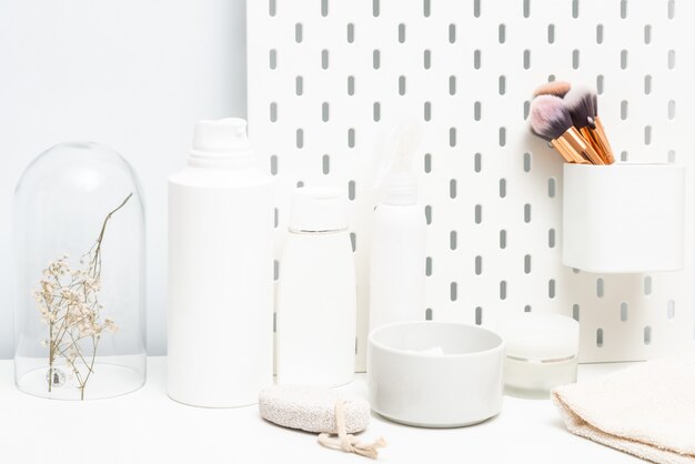 Photo cream and shampoo bottle on bathroom table