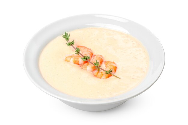 cream soup in white bowl isolated