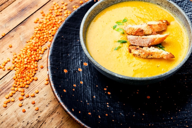 Cream soup with croutons.Yellow lentil cream soup