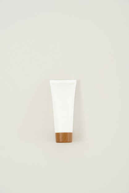 Cream tube with a brown cap