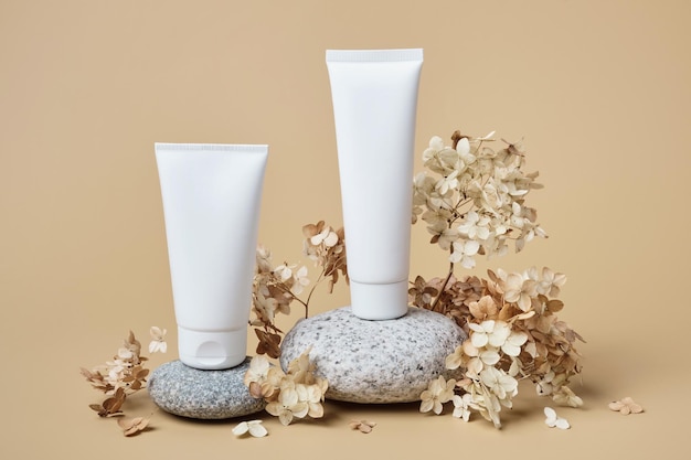 Cream tubes mockup for branding presentation Natural skincare beauty product on rounded pebble podium Natural earthy colors