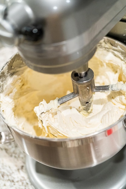 Creamy buttercream frosting whipped in stand mixer bowl