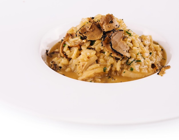 Creamy cheese risotto with slices of truffle