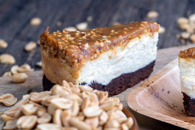 Creamy chocolate cake with caramel and roasted peanuts