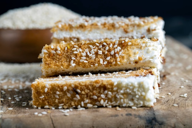 Creamy cream and caramel cakes sprinkled with sesame