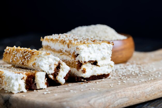 Creamy cream and caramel cakes sprinkled with sesame